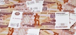 : Рубль растет третий день подряд на господдержке курса